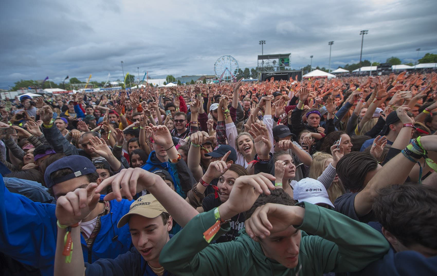 The crowd at Boston Calling Friday night with hands in the air. (Jesse Costa/WBUR)