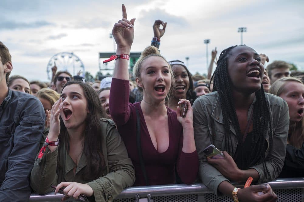 Evie Perrotta, Morgan Pappas and Temi Falayi cheer for Migos at Boston Calling. (Jesse Costa/WBUR)