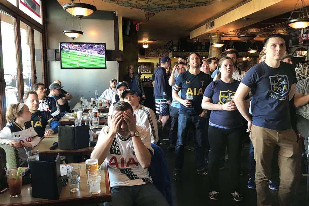 Boston fans of the London soccer club Tottenham Hotspur watch a tense moment of a big match at the Kinsale. (Jeremy D. Goodwin for WBUR)