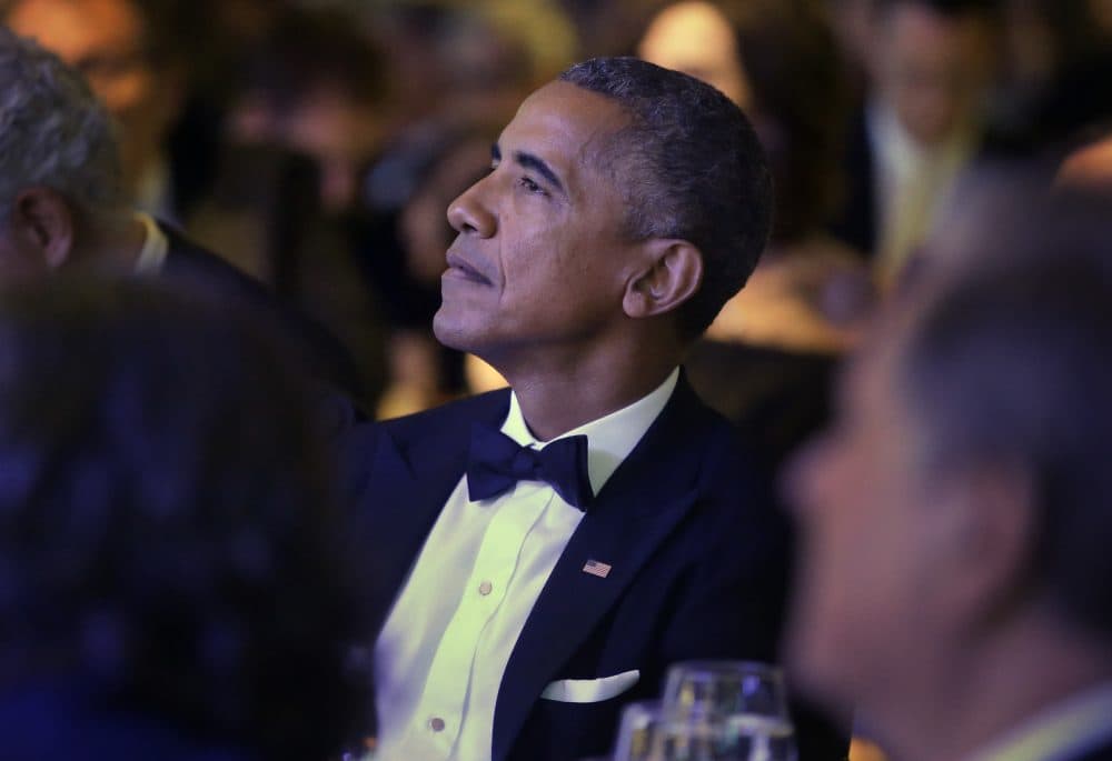 Former President Obama listens to musician James Taylor during the ceremonies. (Steven Senne/AP)