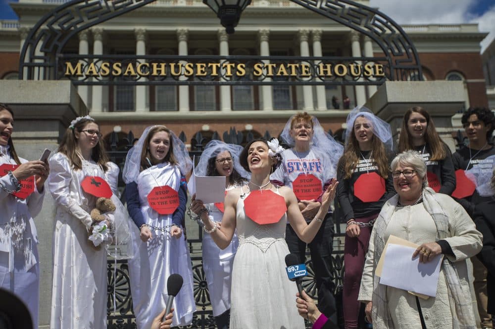 Protesters chant outside the State House during a rally to set a minimum age for marriage in Massachusetts. (Jesse Costa/WBUR)