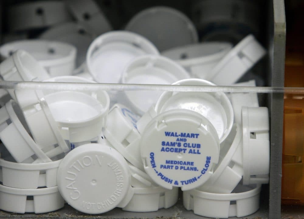 Tops to prescription bottles are pictured inside the Wal-Mart pharmacy Sept. 22, 2006 in Clearwater, Fla. (Robert Sullivan/AFP/Getty Images)