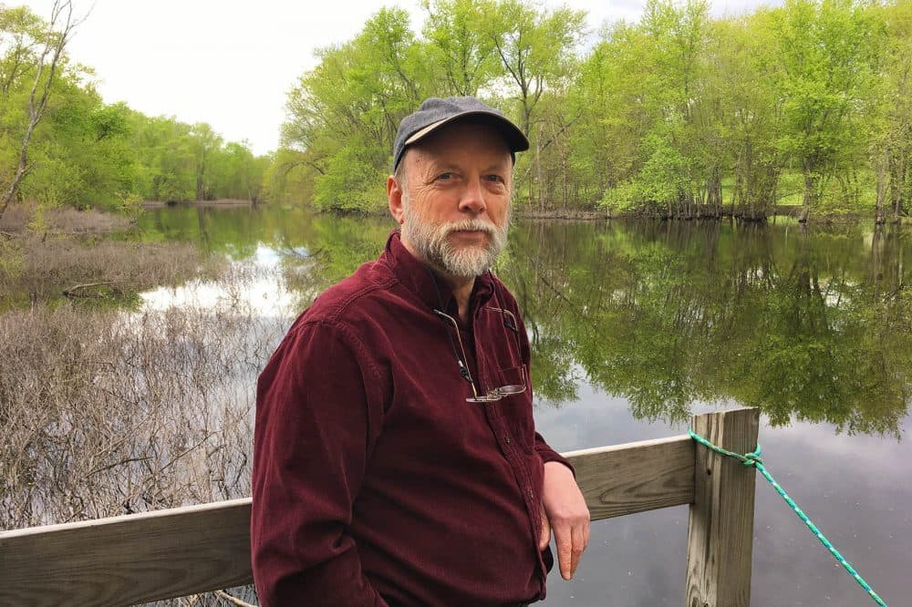 Author Robert Thorson on the Concord River. (Alex Ashlock/Here &amp; Now)