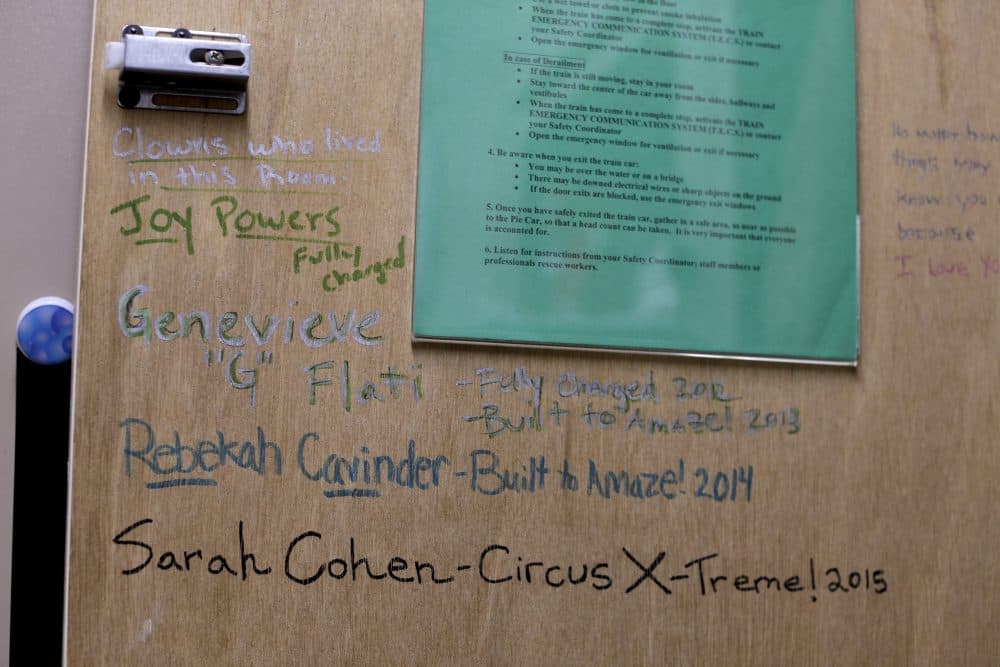 A cabinet door inside a clown's living quarters on the train displays messages and signatures from past clowns who have lived in that room. (Julie Jacobson/AP)