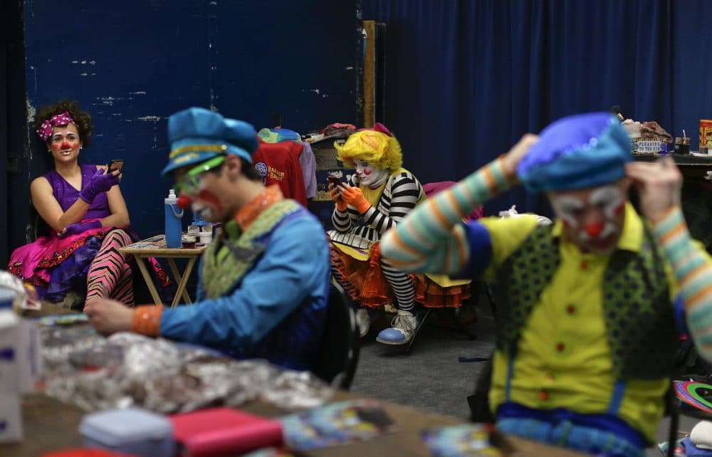 Ringling Bros. clowns take a break between acts in &quot;Clown Alley,&quot; a private area backstage on May 5. (Julie Jacobson/AP)