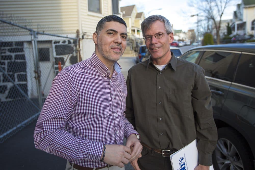 Tony Hernandez, left, and Harry Smith, of Dudley Street Neighborhood Initiative, say their community land trust has put development decisions into the hands of the community. &quot;Our motto ... is development without displacement,&quot; Smith said. (Jesse Costa/WBUR)