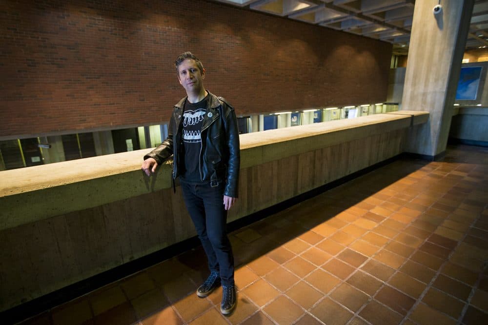 Artist Jesse Kaminsky stands in front of the space where his piece will reside.(Jesse Costa/WBUR)
