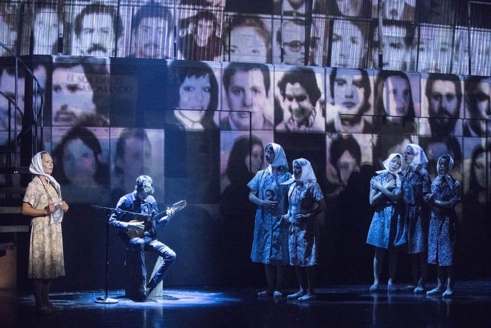 The many faces of Argentina’s Disappeared projected behind the ensemble portraying mothers, desperate to find their missing children. (Courtesy Gretjen Helene Photography)