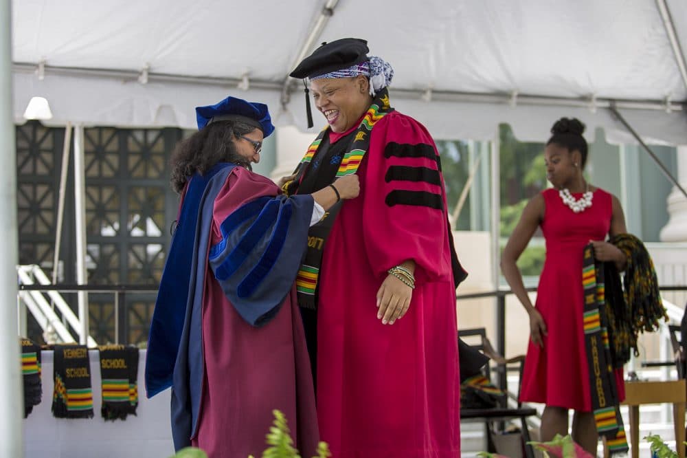 Arts and sciences graduate Funlayo Wood receives her graduation stole. (Jesse Costa/WBUR)