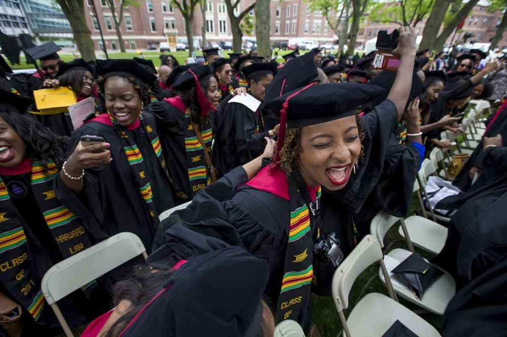 Black students at Harvard University held the university's first-ever Black Commencement on Tuesday. Here, graduates celebrate after the ceremony. (Jesse Costa/WBUR)