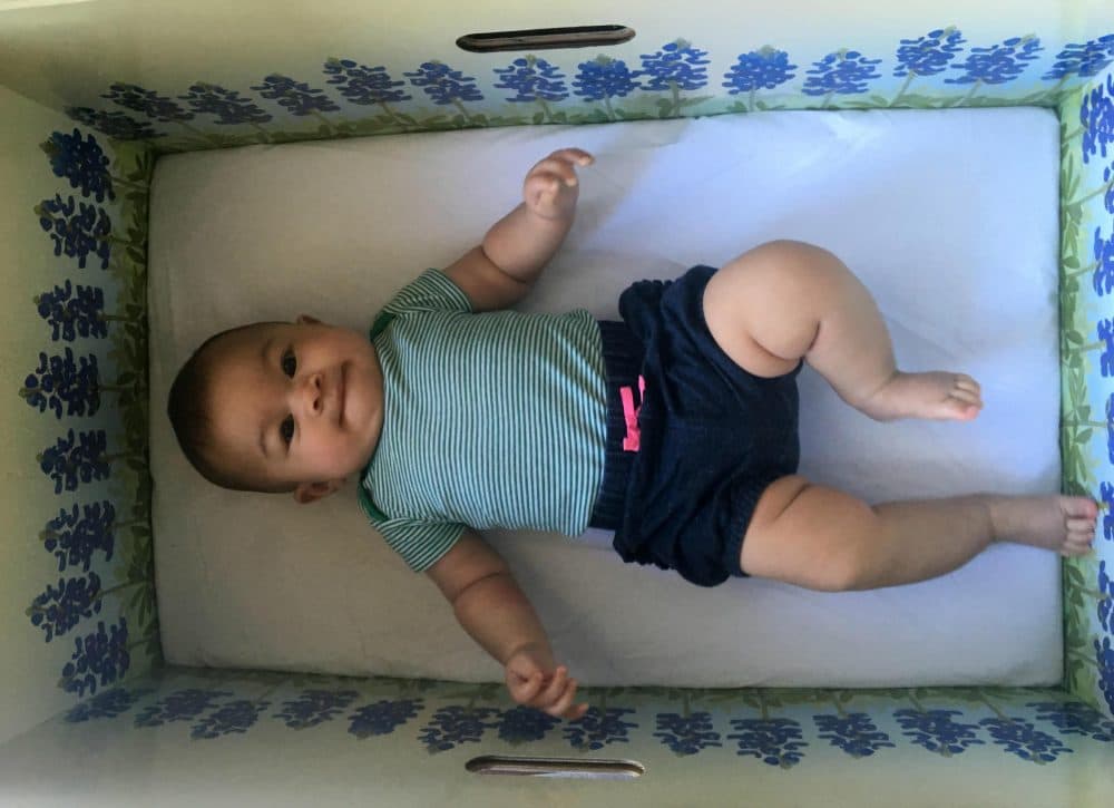 Penelope, 4 months old, in a &quot;baby box.&quot; (Lauren Silverman/KERA)