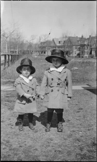Joseph P. Kennedy, Jr., and John F. Kennedy (holding hands) wear matching coats and hats in Brookline, Massachusetts. (Courtesy JFK Library and Museum in Boston)