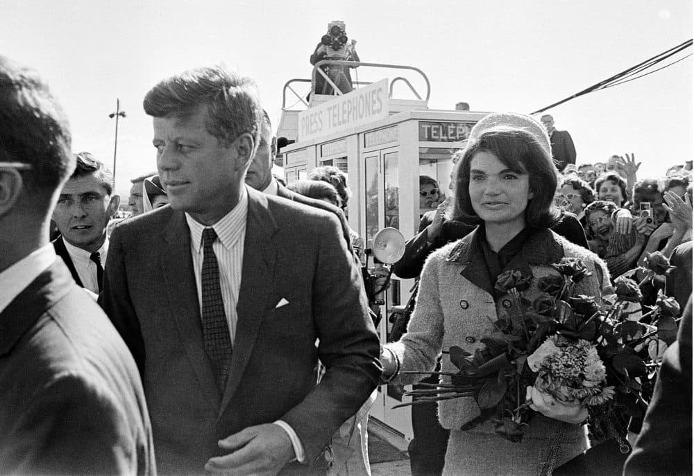 President Kennedy and his wife Jacqueline Kennedy are greeted by an enthusiastic crowd upon their arrival at Dallas Love Field on Nov. 22, 1963. Only a few hours later, the president was assassinated while riding in an open-top limousine. (AP)