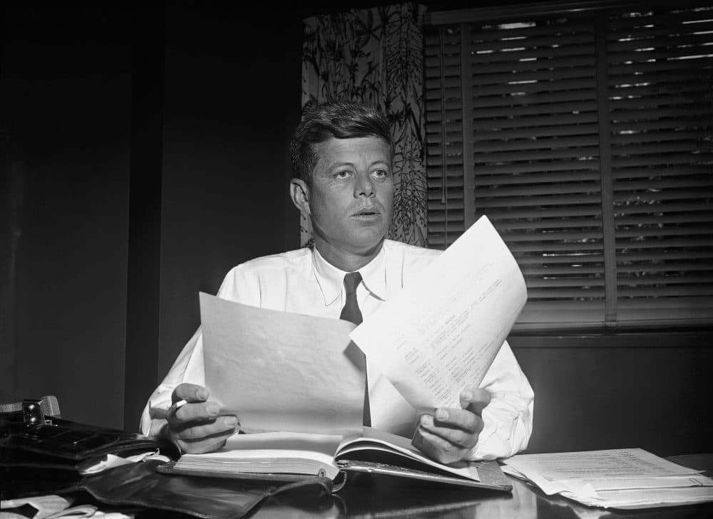 Sen. John Kennedy as he catches up on his work in his hotel suite, May 24, 1955, after returning to the capital after an eight-month absence, following an operation. (Bill Allen/AP)