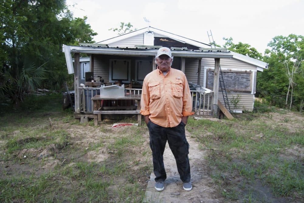 Kevin Rutley stands on land owned by his family on the Barataria Waterway. (Virginia Hanusik for Here &amp; Now)