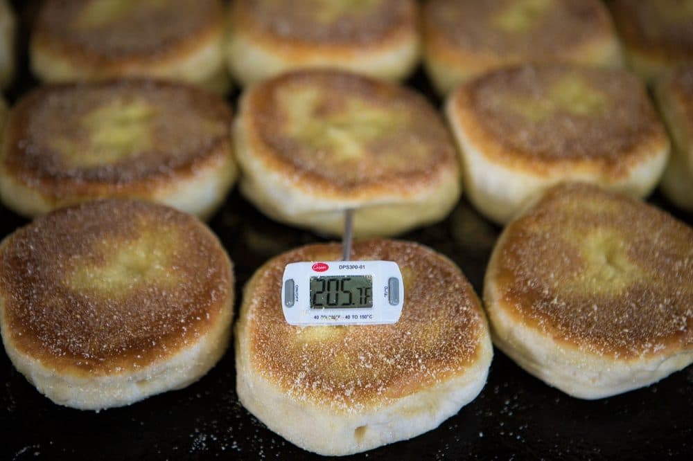 In this 2015 file photo, a thermometer shows an internal temperature of 205 degrees, before pulling English muffins off the grill. (Jesse Costa/WBUR)