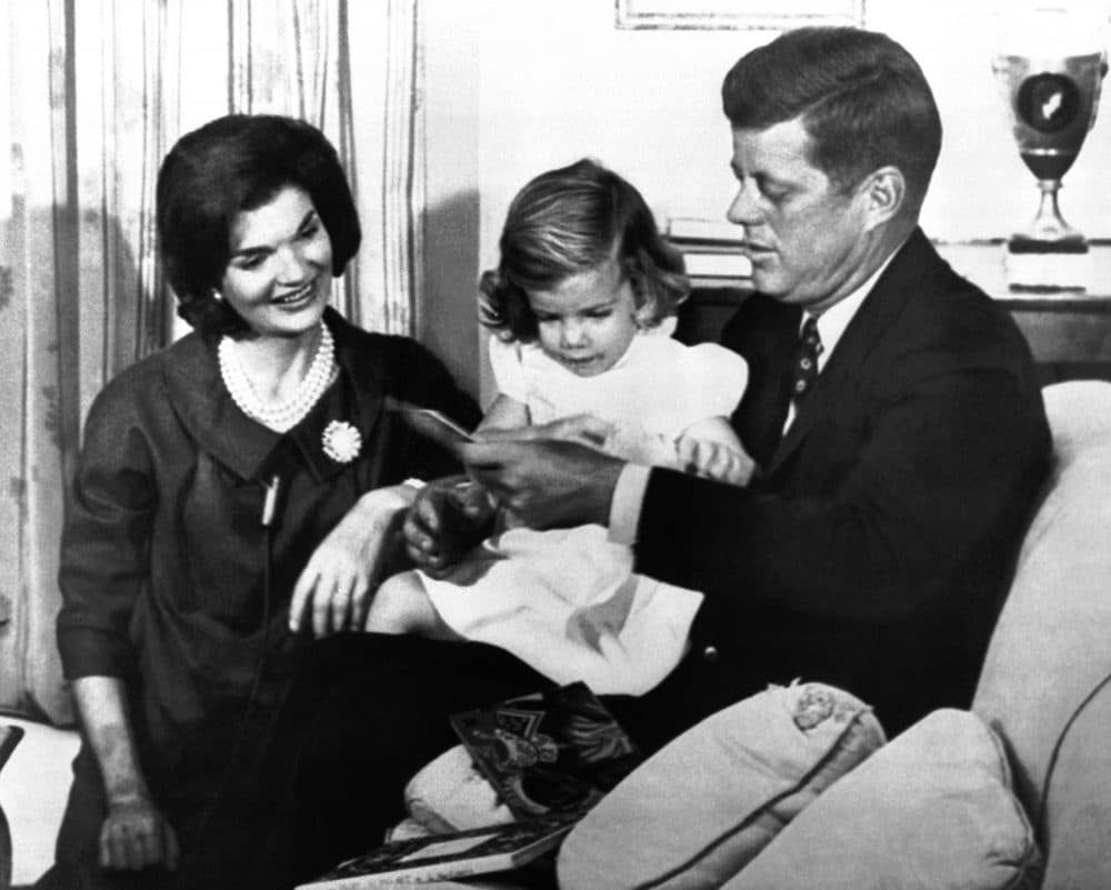 Democratic presidential candidate Sen. John Kennedy and his wife Jacqueline and daughter Caroline in their home in Georgetown on Sept. 19, 1960, while taping a television program. (AP)