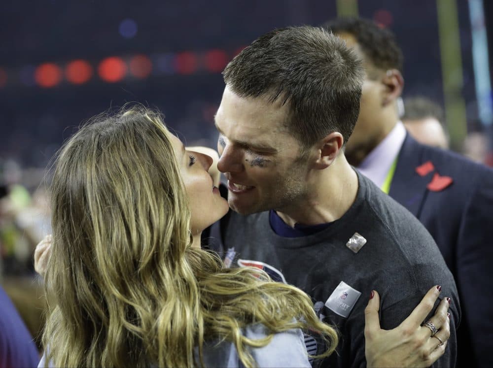Tom Brady kisses his wife, Gisele Bundchen, after the Patriots Super Bowl win in February. (Patrick Semansky/AP)
