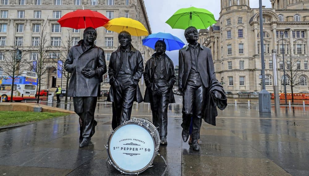 The sixties produced a glorious body of music that spoke to the era’s overheated idol worship, a commentary that still speaks to the Trump phenomenon, writes Tim Riley. In this photo, umbrellas are placed over the statute of the Beatles on Liverpool's waterfront, in Liverpool, England, Wednesday, March 22, 2017. The city is celebrating the half-centenary of &quot;Sgt. Pepper's Lonely Hearts Club Band,&quot; one of the band's most influential albums. (Peter Byrne/ PA via AP)