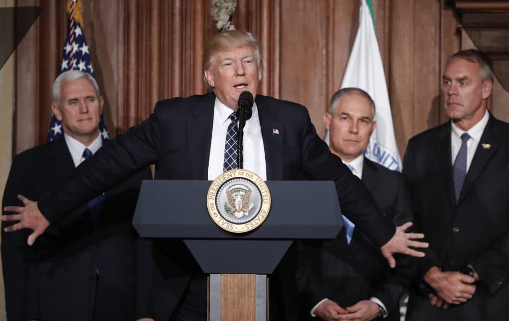 President Trump, accompanied by, from left, Vice President Pence, Environmental Protection Agency Administrator Scott Pruitt and Interior Secretary Ryan Zinke, at EPA headquarters on March 28, 2017 (Pablo Martinez Monsivais/AP)