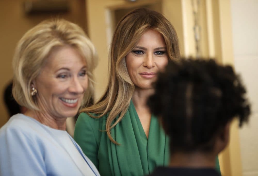 First lady Melania Trump, center, and Education Secretary Betsy DeVos, left, talk with student Michelle McCord, 13, right, during their visit to the Excel Academy Public Charter school in Washington, Wednesday, April 5, 2017. (Pablo Martinez Monsivais/ AP)