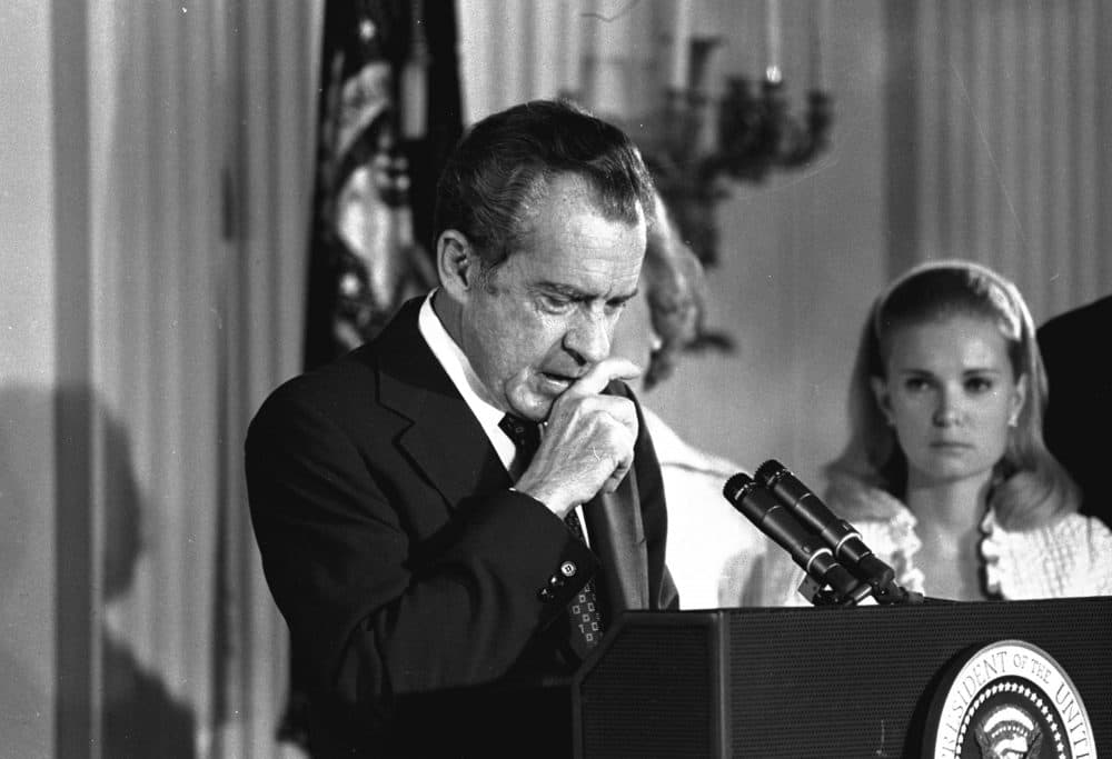 Richard Nixon performs the last acts of his devastated presidency in the White House East Room, Aug. 9, 1974, as he bids farewell to his Cabinet, aides and staff. (AP)