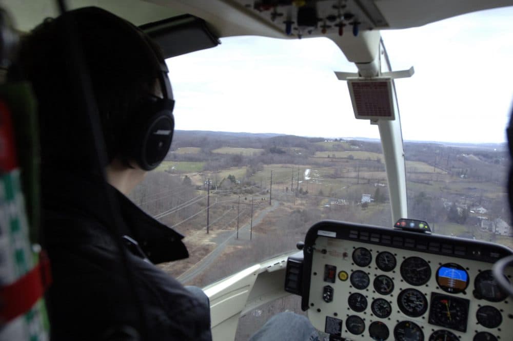 Eversource uses helicopter flights, in part, to monitor power lines for debris and vegetation, which could fall and compromise electricity flow. (Courtesy of Eversource)
