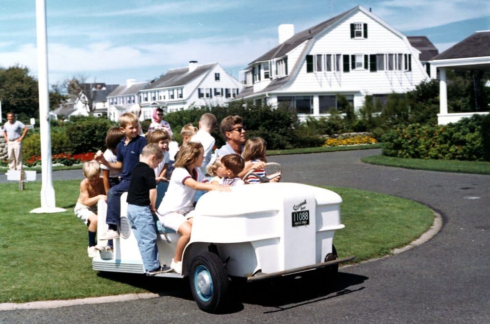 President John F. Kennedy drives his nieces and nephews around the lawn in a golf cart on Hyannis Port, Massachusetts. (Courtesy Robert Knudsen/White House Photographs/JFK Library)