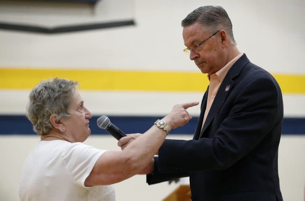 Marcia Kupka, of Clutier, Iowa, asks Rep. Rod Blum, R-Iowa, a question during a town hall meeting, Thursday, May 11, 2017, in Marshalltown, Iowa. (Charlie Neibergall/AP)