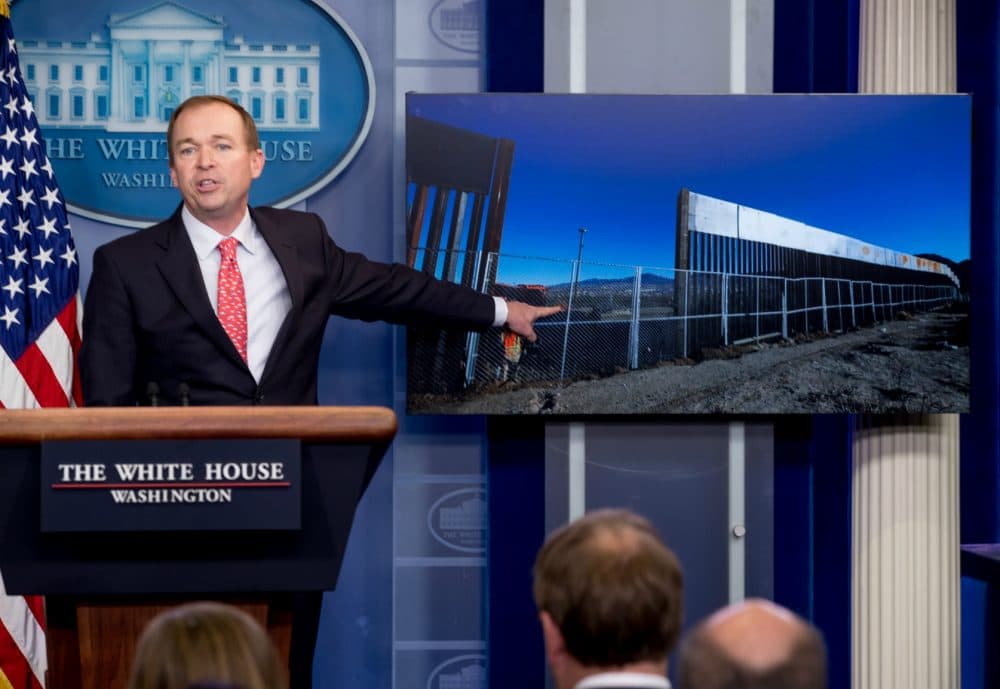 Tom Keane: "Democrats scored big victories in the latest budget showdown." Pictured: Budget Director Mick Mulvaney points to an image of the border wall during the daily press briefing at the White House, Tuesday, May 2, 2017. (Andrew Harnik/AP)