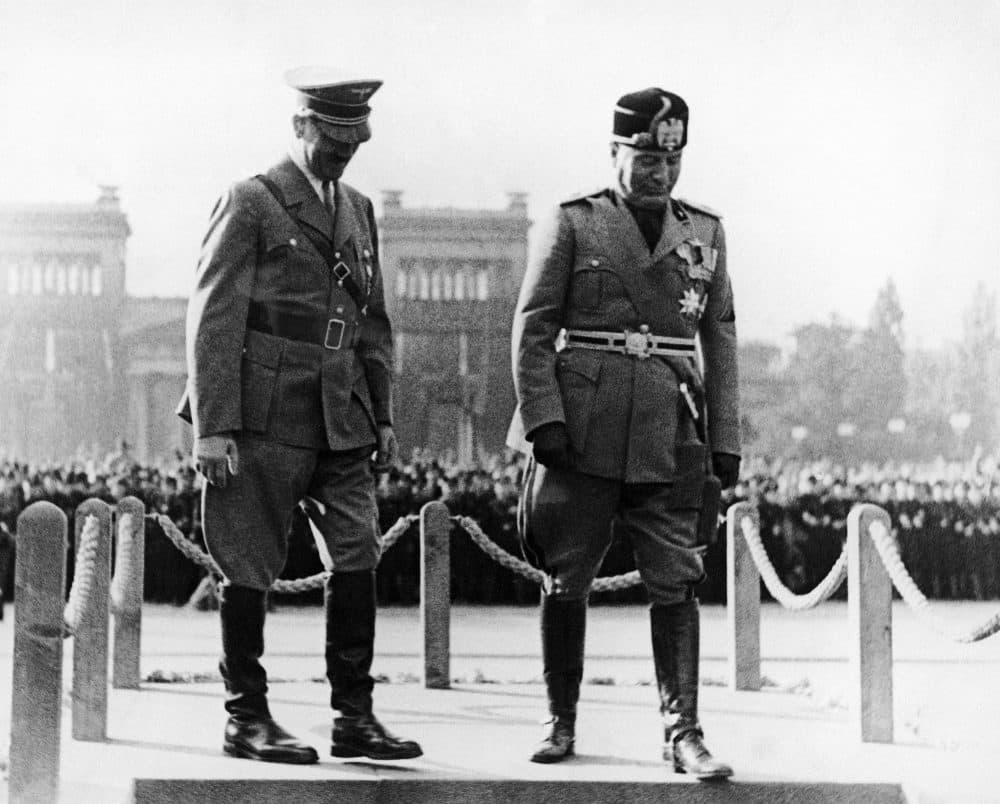 Chancellor Adolf Hitler of Germany, left, welcomes Premier Benito Mussolini of Italy to Munich, Germany, Sept. 25, 1937, during a visit by Il Duce. (AP Photo)
