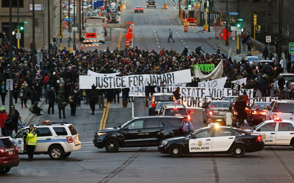 Hundreds of Black Lives Matter demonstrators occupy the street in front of the federal building, Tuesday, Nov. 24, 2015, in Minneapolis. (Jim Mone/AP)