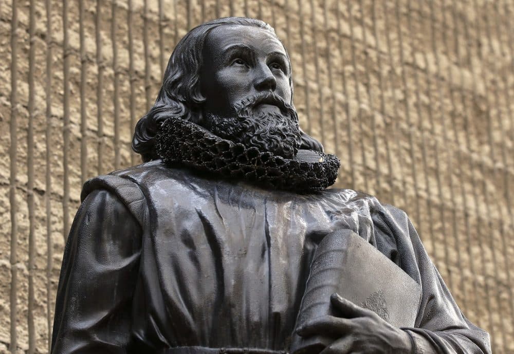 A bronze statue of Puritan John Winthrop, by sculptor Richard Saltonstall Greenough, stands outside the First Church in Boston. (Steven Senne/AP)