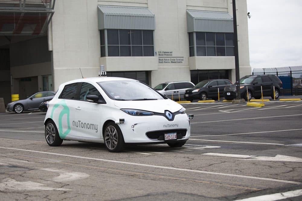 With a driver in the front seat, a nuTonomy's self-driving vehicle is tested on Black Falcon Avenue in Boston's Seaport District. (Jesse Costa/WBUR)