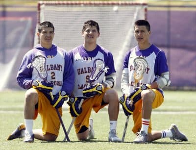 Miles (left) and Lyle (right) along with their cousin Ty at the University of Albany in 2014. (Mike Groll, File/AP)