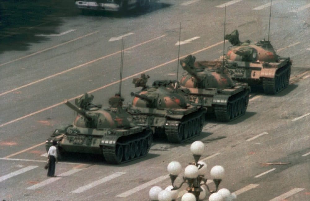 A Chinese man stands alone to block a line of tanks heading east on Beijing's Cangan Blvd. in Tiananmen Square on June 5, 1989. (Jeff Widener/AP)