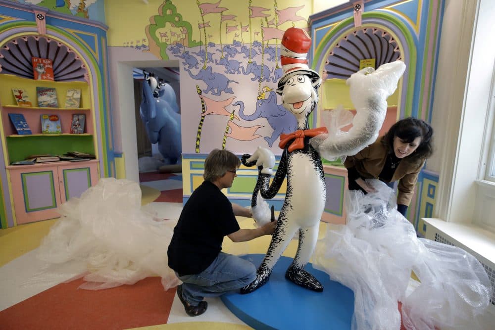 Museum staff work to finalize an installation of the Cat in the Hat ahead of the museum's opening on June 3. (Steven Senne/AP)