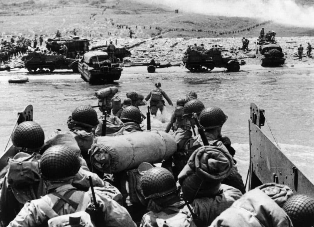 American assault troops and equipment landing on Omaha Beach on the northern coast of France on D-Day. (Fox Photos/Getty Images)