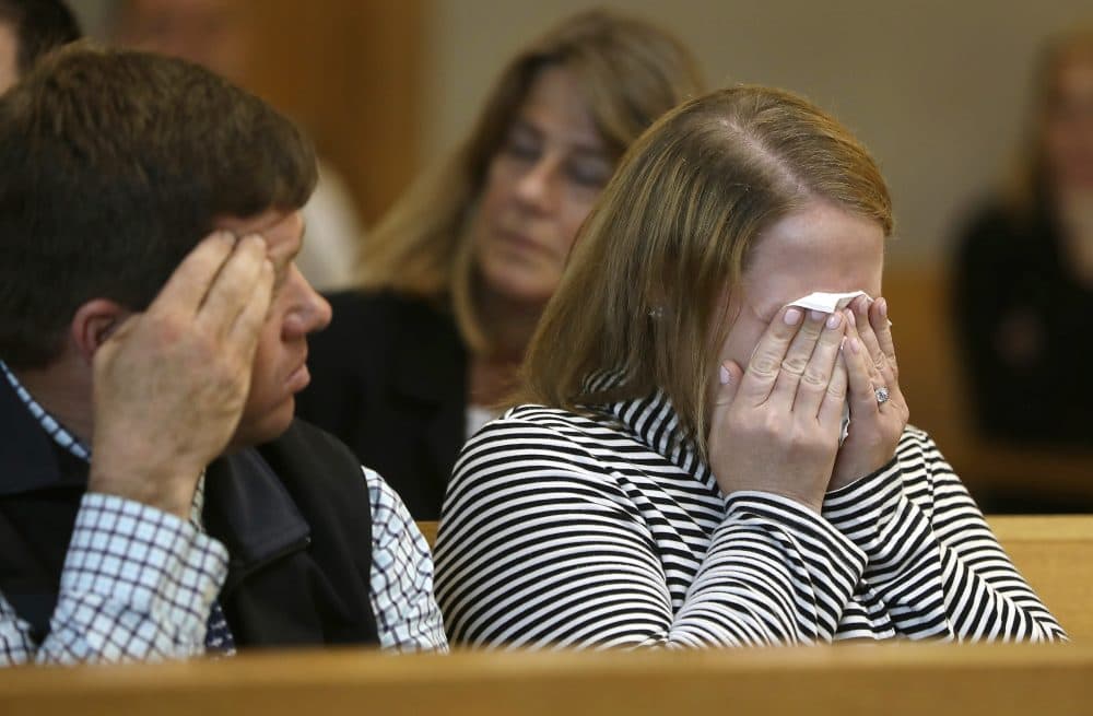 Roy family members react when crime-scene photos are projected during the trial of Michelle Carter on Tuesday. (Pat Greenhouse/The Boston Globe via AP, pool)