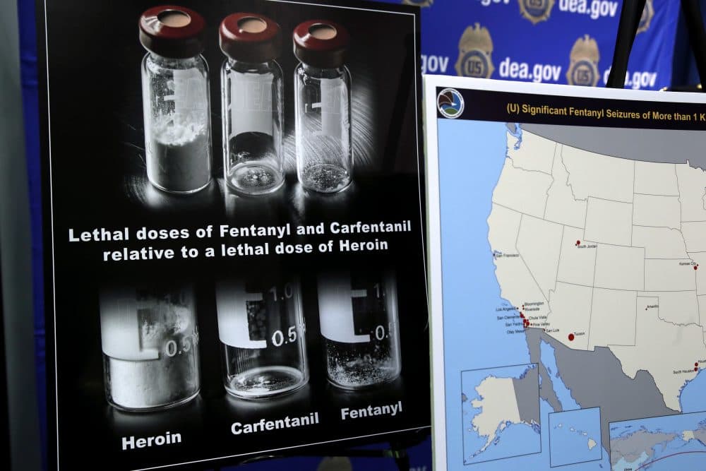 Posters comparing lethal amounts of heroin, fentanyl and carfentanil are on display during a news conference at DEA Headquarters in Arlington, Va., on Tuesday. (Jacquelyn Martin/AP)