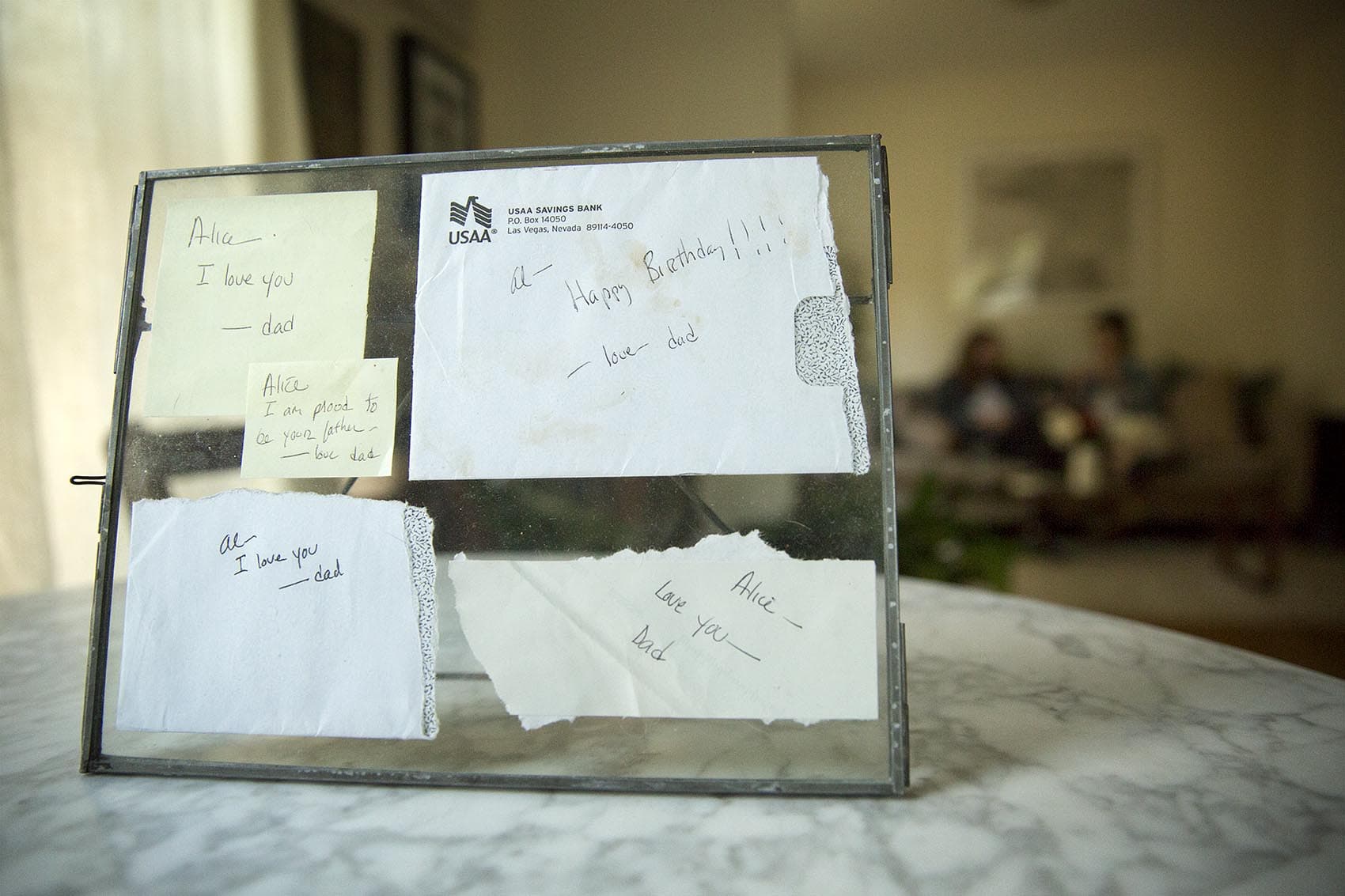 Framed notes from Arpy Saunders to his daughter, Alice. (Robin Lubbock/WBUR)