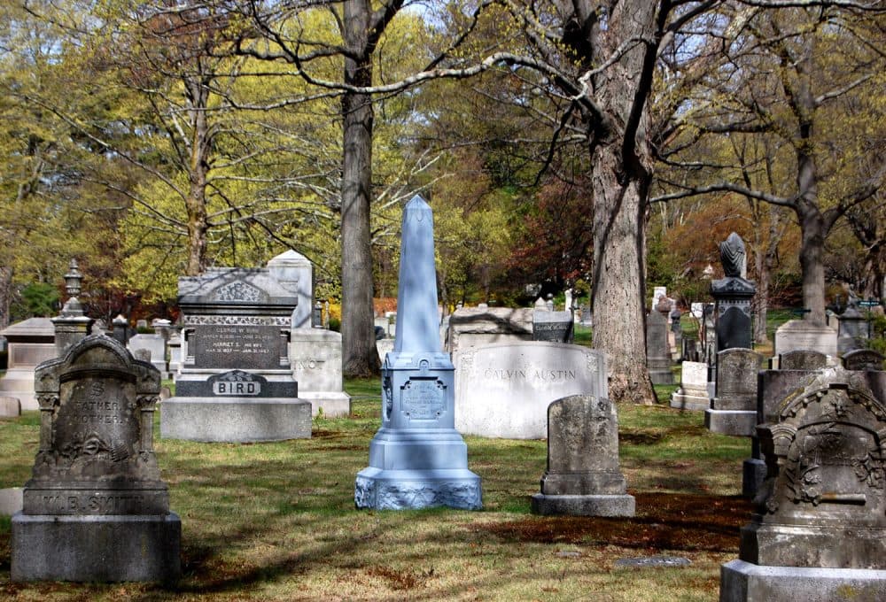 The blue tone of the Brown family obelisk at Boston’s Forest Hills Cemetery identifies it as hollow zinc. (Greg Cook/WBUR)