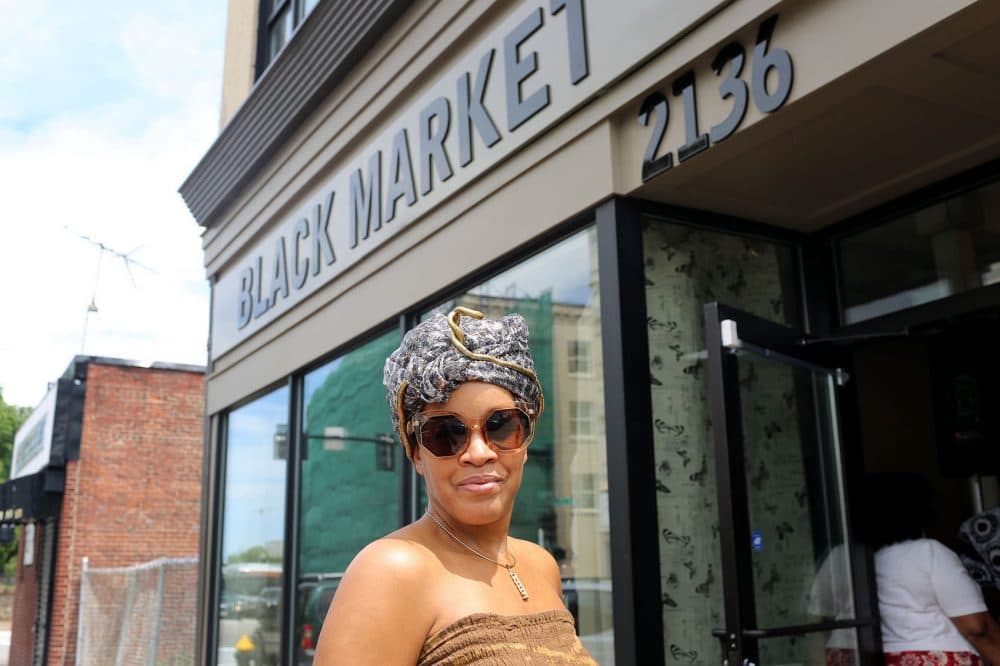 Kai Grant is the owner and curator of Black Market in Dudley Square. (Hadley Green for WBUR)