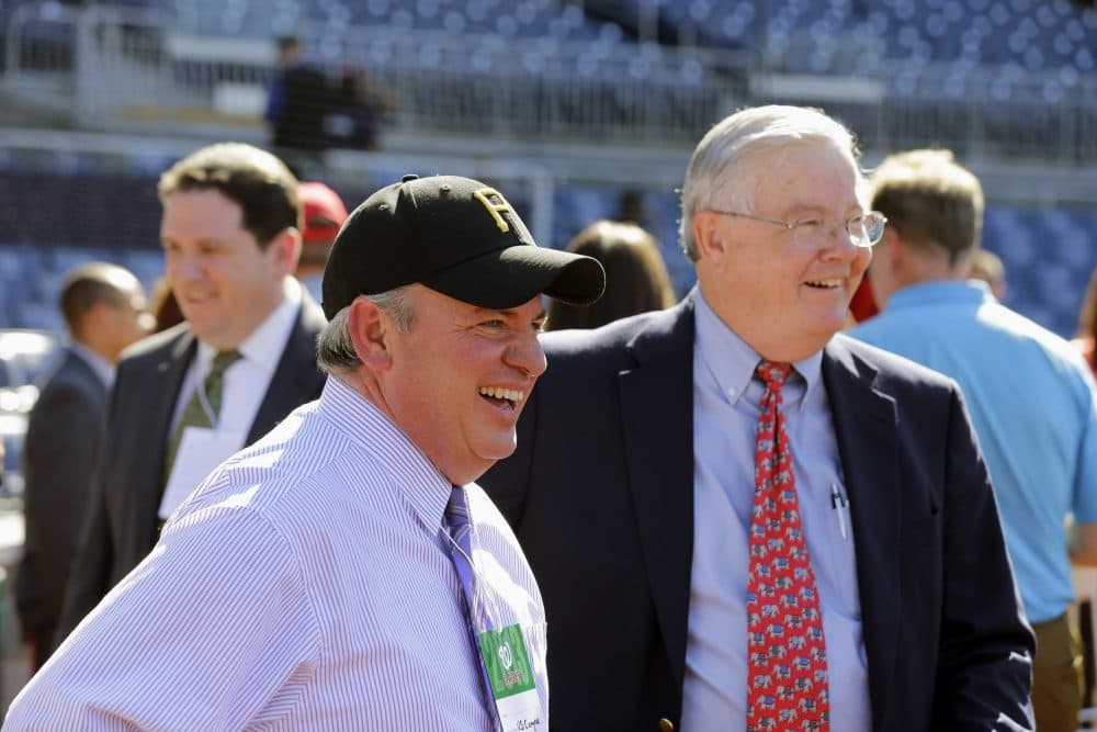 They may be from different parties but a love of the national pastime has brought Reps. Mike Doyle (D-Pa.), at left, and Joe Barton (R-Texas) together. The two managers of the congressional baseball squads are seen here catching a pro game at Nationals Park. (Alex Brandon/AP)