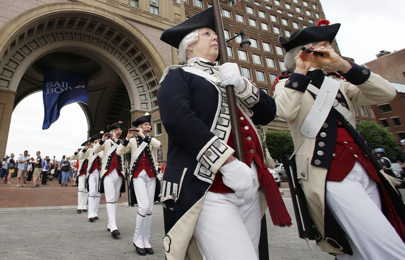 The Middlesex County Volunteers Fife and Drums march away following opening ceremonies for the Sail Boston tall ships event on Friday in Boston. (AP Photo/Michael Dwyer)