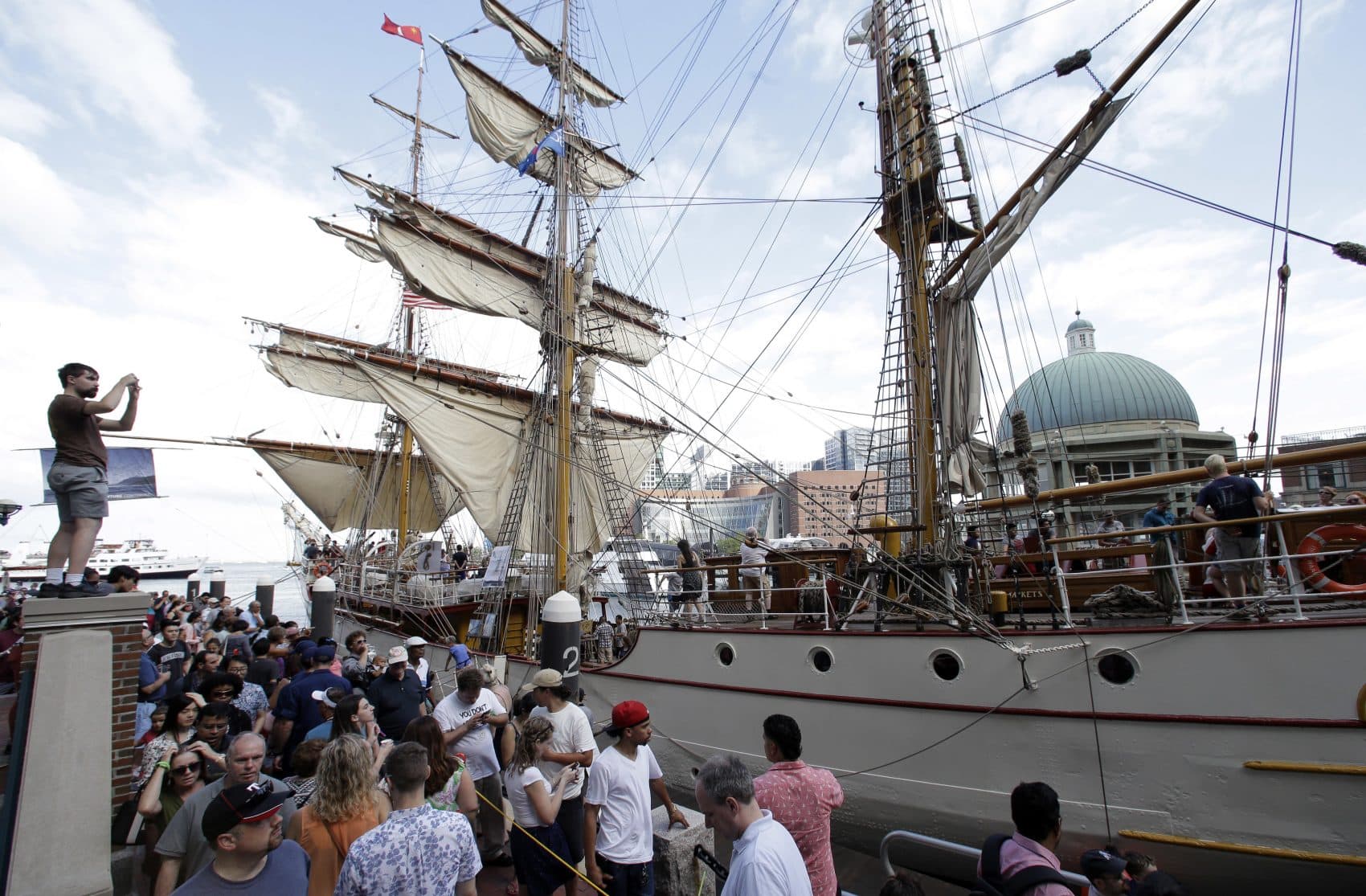 Crowds make their way past the Europa, a tall ship registered in the Netherlands during Sail Boston on Sunday. (Steven Senne/AP)