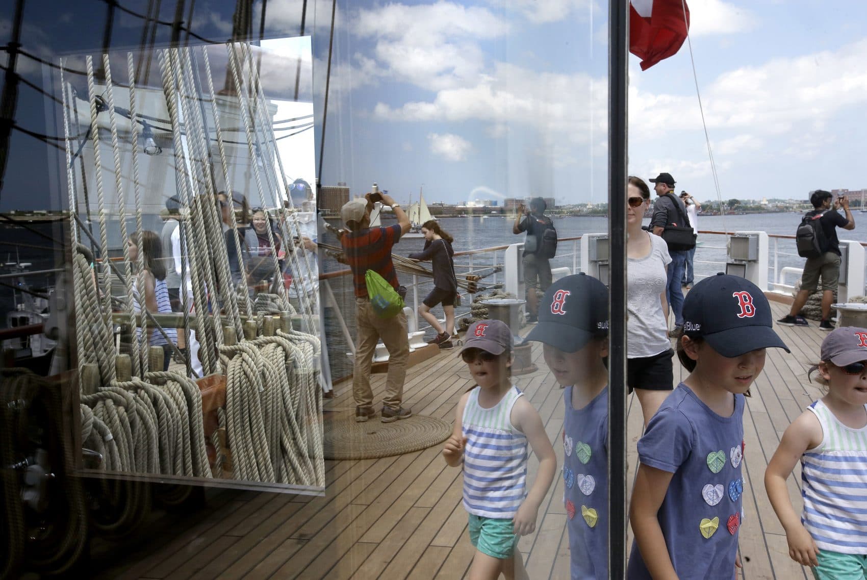 Visitors walk along a deck on the Peruvian Navy tall ship Union as part of the Sail Boston event on Sunday. (Steven Senne/AP)