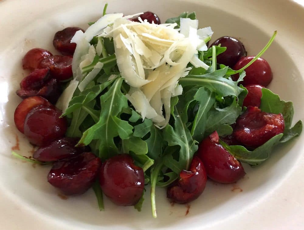 Kathy's roasted balsamic cherry salad with arugula and Parmesan shavings. (Kathy Gunst for Here &amp; Now)