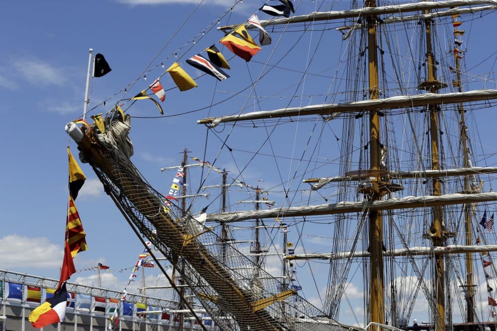 Flags fly on tall ships that are docked in Boston on Wednesday. More than 50 tall ships from Europe, South America and the U.S. converged on the city as part of the Rendez-Vous 2017 Tall Ships Regatta. (Elise Amendola/AP)