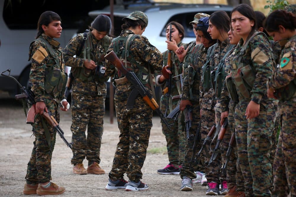 Fighters from the Kurdish female Women's Protection Units (YPJ) gather during an exercise at a training facility in the northeastern Syrian Kurdish town of Derik, on June 1, 2017. (Delil Souleiman/AFP/Getty Images)